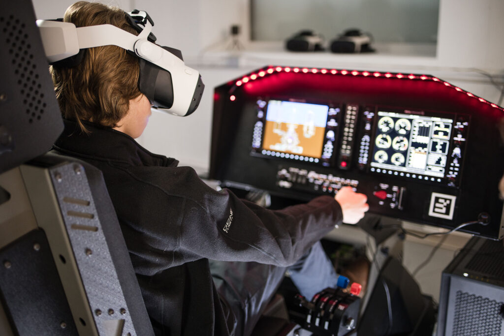 student using immersive flight training device ImMRsiv