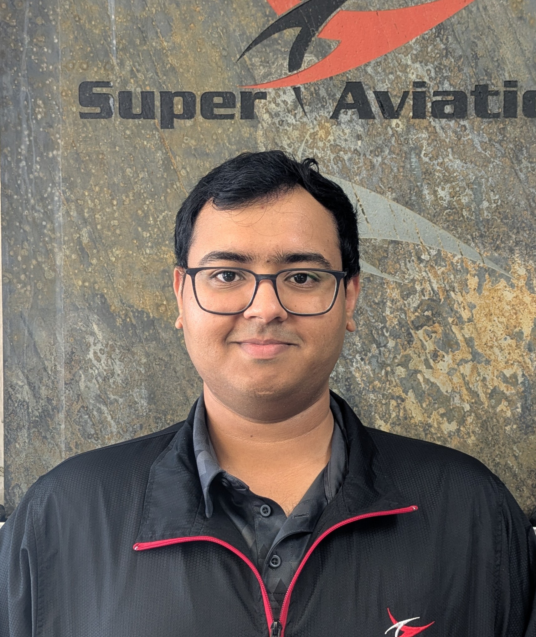 Eshan Flight Training specialist man standing and smiling